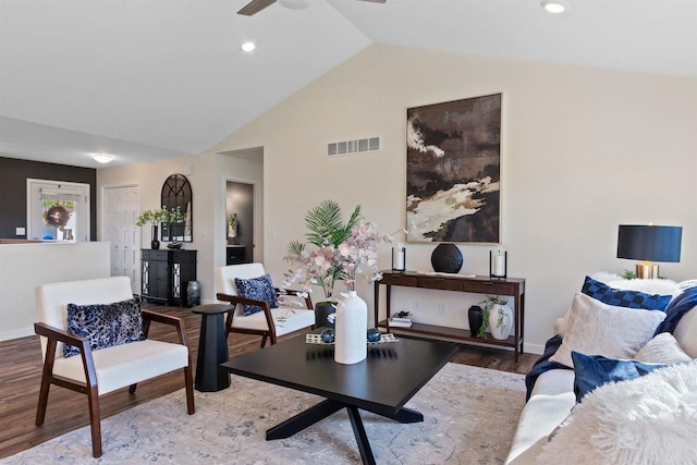 living room featuring light wood-type flooring, vaulted ceiling, and ceiling fan