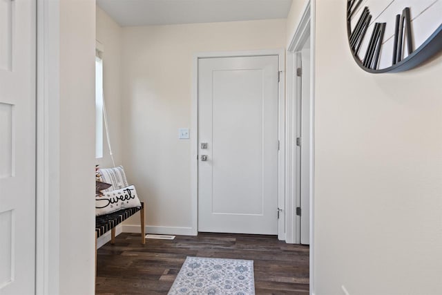 interior space with dark hardwood / wood-style flooring