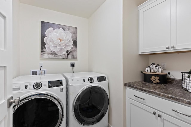 laundry room featuring cabinets and independent washer and dryer