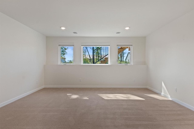 empty room featuring light colored carpet