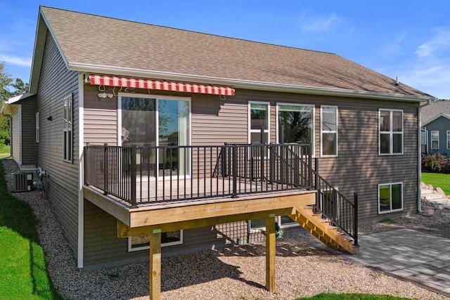 back of house with a wooden deck and central AC