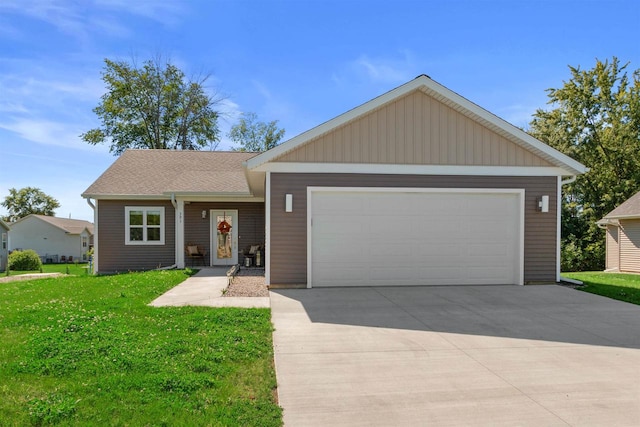 ranch-style home featuring a garage and a front lawn