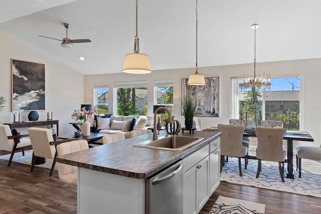 kitchen with dishwasher, plenty of natural light, hanging light fixtures, and white cabinets