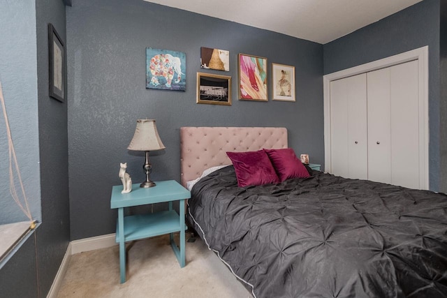 carpeted bedroom featuring a closet