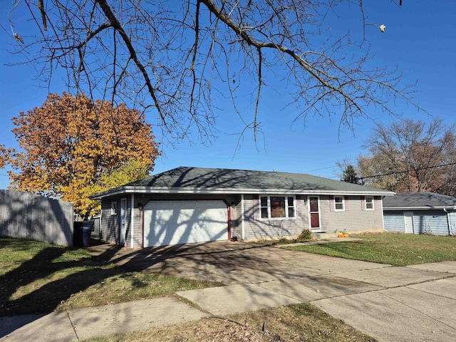 view of front of property featuring a garage and a front yard