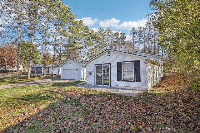 view of front of house with a garage and a front yard