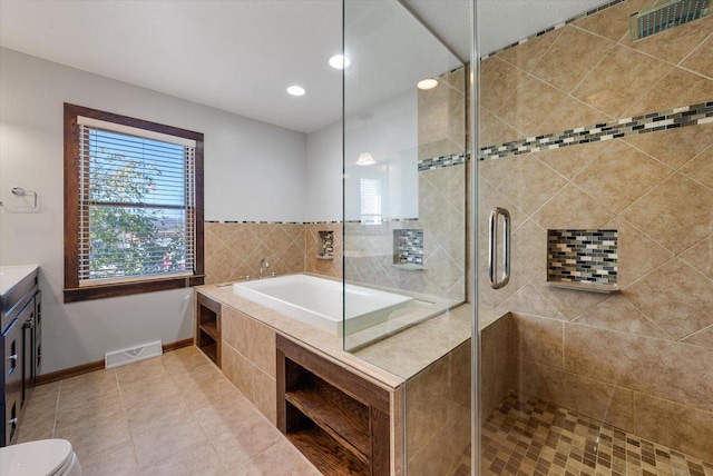 full bathroom with vanity, tile patterned flooring, toilet, and plus walk in shower