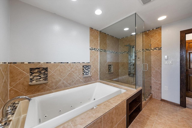 bathroom featuring tile patterned flooring and shower with separate bathtub