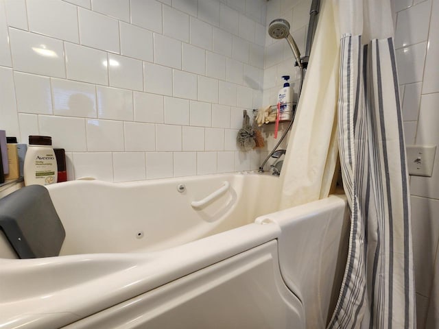 bathroom with shower / tub combo with curtain