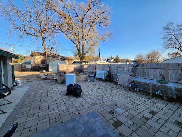 view of patio / terrace featuring a shed