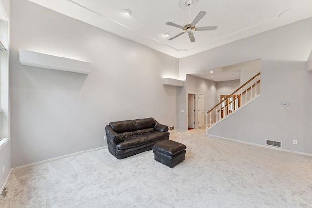 sitting room with carpet floors and ceiling fan