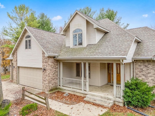 view of front of home with a porch and a garage