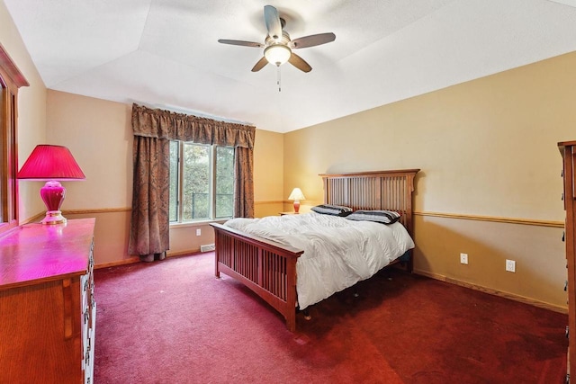 bedroom with vaulted ceiling, ceiling fan, and carpet floors