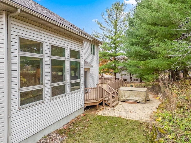 exterior space featuring a patio area and a deck