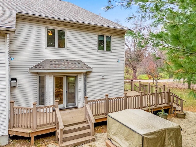 rear view of house with a wooden deck