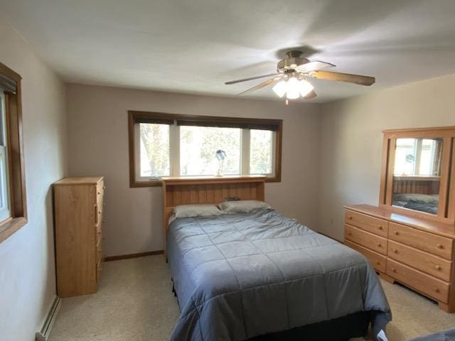 bedroom with light colored carpet and ceiling fan