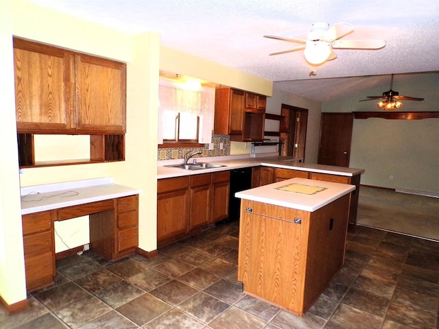 701 S Adams St, Thorp, WI 54771 - kitchen with a sink, a peninsula, ceiling fan, light countertops, and vaulted ceiling