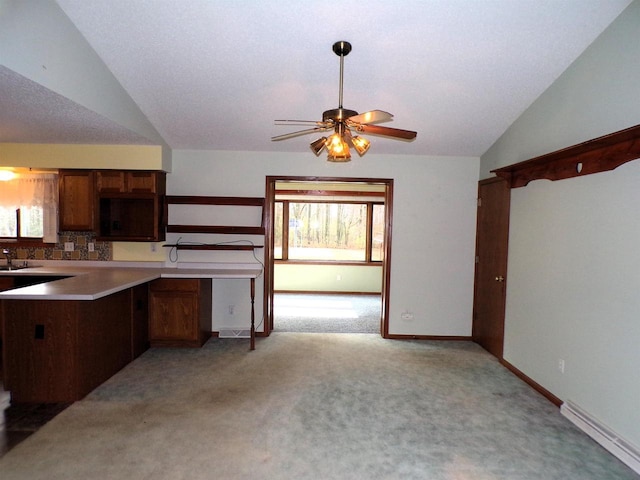 701 S Adams St, Thorp, WI 54771 - kitchen with vaulted ceiling, ceiling fan, light carpet, plenty of natural light, and baseboards