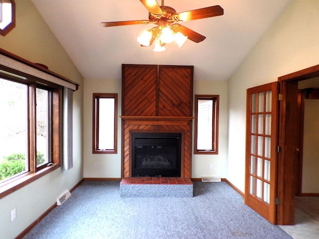 701 S Adams St, Thorp, WI 54771 - unfurnished living room with vaulted ceiling, carpet flooring, ceiling fan, a large fireplace, and baseboards