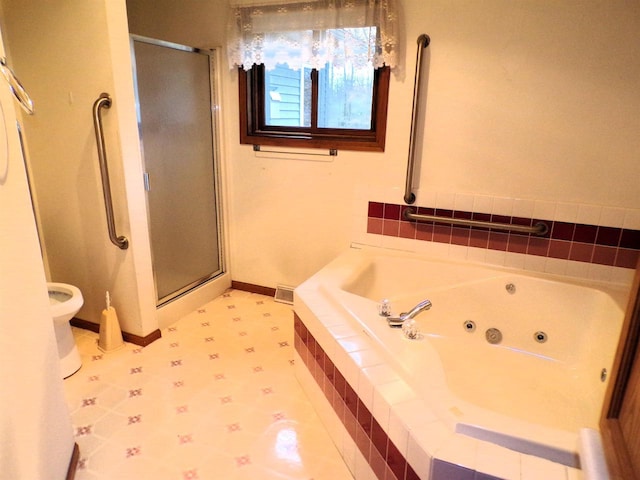 701 S Adams St, Thorp, WI 54771 - bathroom featuring a stall shower, a whirlpool tub, tile patterned floors, and toilet