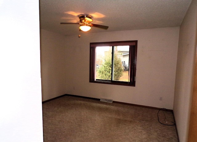 701 S Adams St, Thorp, WI 54771 - carpeted empty room with baseboards and a ceiling fan