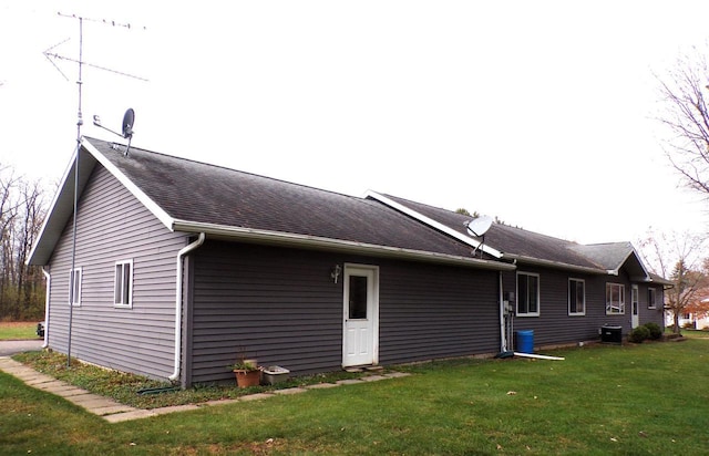 701 S Adams St, Thorp, WI 54771 - back of house featuring a yard and central AC