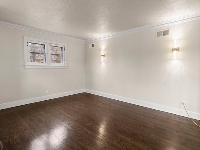 unfurnished room with crown molding, dark hardwood / wood-style flooring, and a textured ceiling