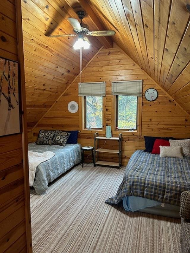 carpeted bedroom featuring vaulted ceiling with beams, ceiling fan, wooden ceiling, and wooden walls