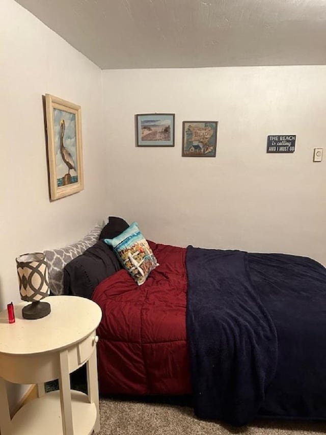 bedroom featuring light carpet