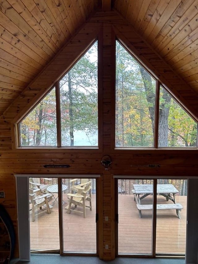 details featuring beamed ceiling, wood walls, and wooden ceiling