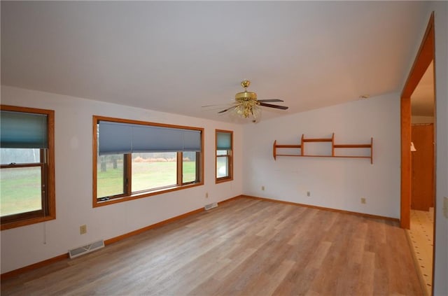 unfurnished room featuring ceiling fan and light hardwood / wood-style flooring