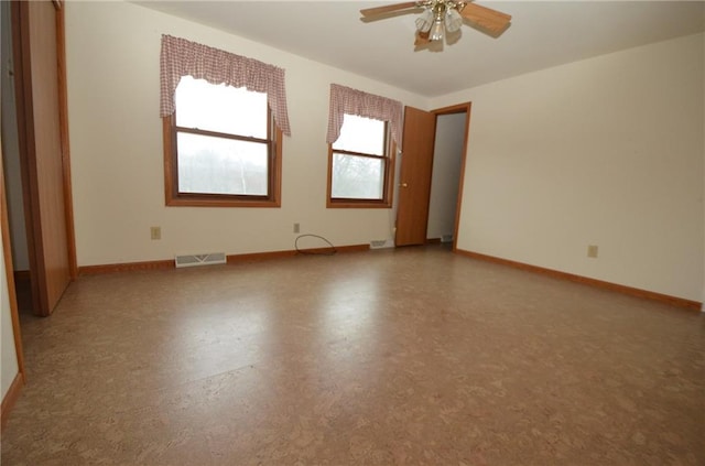 spare room with ceiling fan