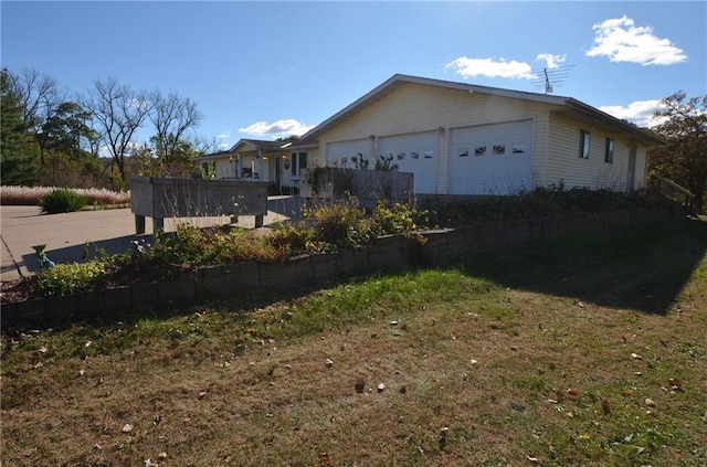 view of side of home featuring a garage