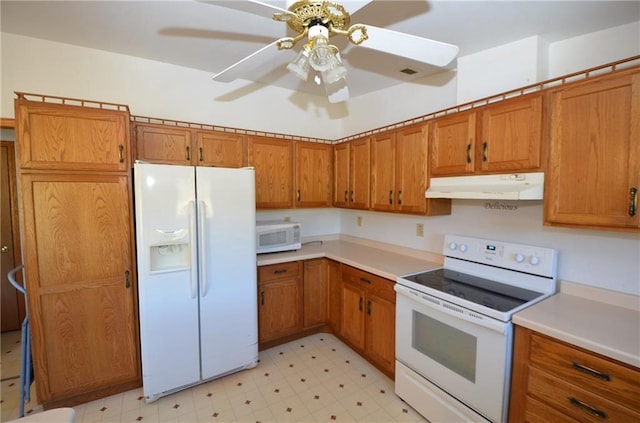 kitchen with ceiling fan and white appliances