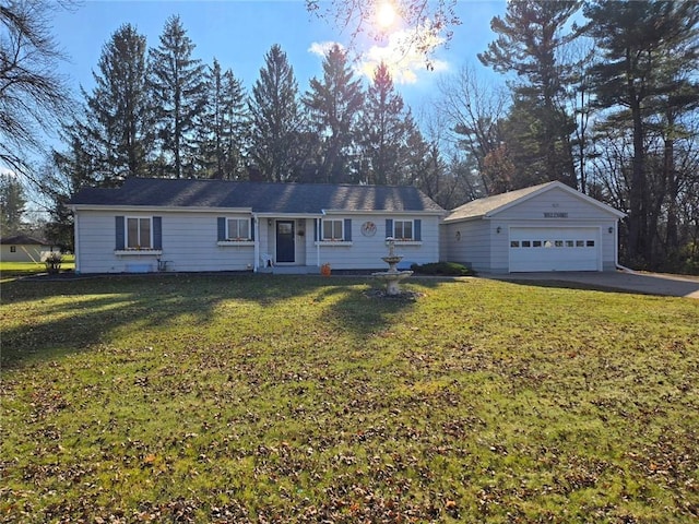 ranch-style house with a garage and a front lawn