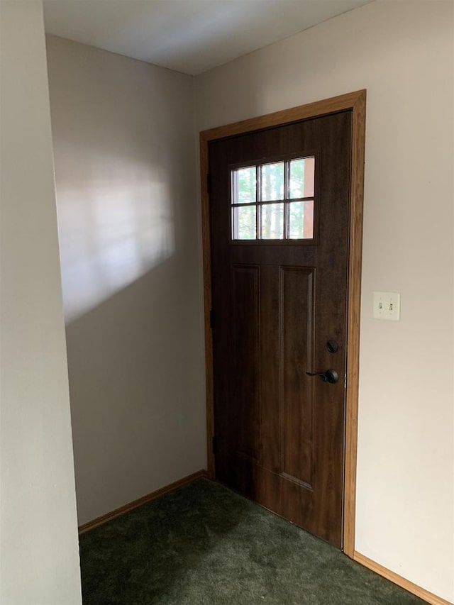 view of carpeted entrance foyer