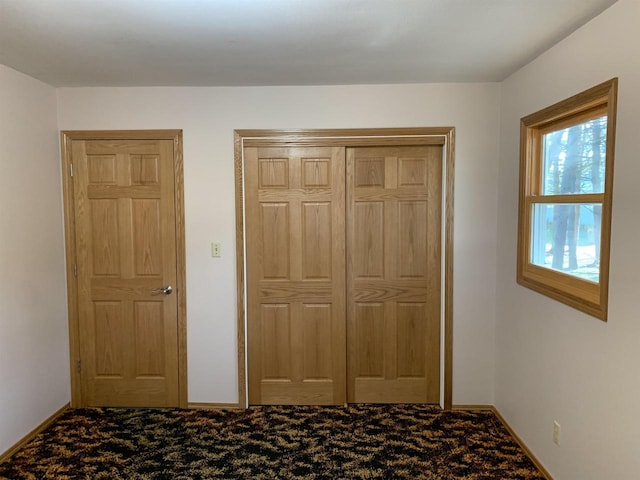 unfurnished bedroom with carpet flooring