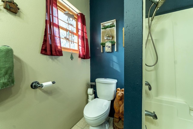 bathroom with walk in shower, tile patterned floors, and toilet