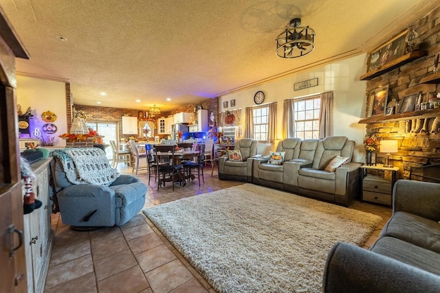 living room featuring ornamental molding, a textured ceiling, and tile patterned floors