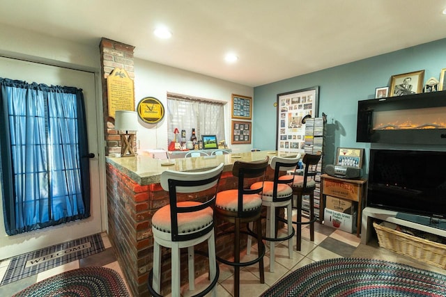 bar featuring light tile patterned floors