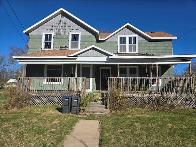 view of front of house featuring a porch and a front lawn