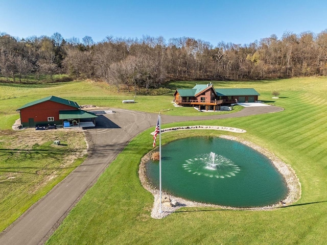 E7498 Mill Rd, Spring Green, WI 53588 - surrounding community featuring driveway, a water view, and a lawn