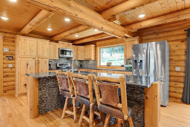 E7498 Mill Rd, Spring Green, WI 53588 - kitchen with appliances with stainless steel finishes, a wooden ceiling with exposed beams, light wood-type flooring, an island with sink, and light brown cabinets