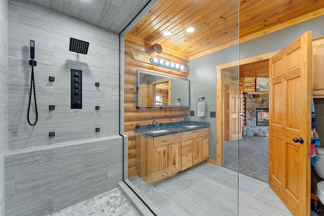 E7498 Mill Rd, Spring Green, WI 53588 - full bath with a walk in shower, double vanity, wooden ceiling, a fireplace, and tile patterned flooring