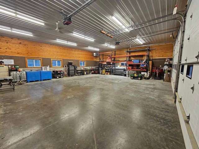 E7498 Mill Rd, Spring Green, WI 53588 - garage featuring a workshop area and a garage door opener