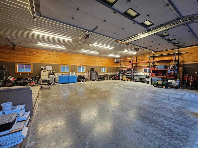 E7498 Mill Rd, Spring Green, WI 53588 - garage featuring a workshop area and a garage door opener