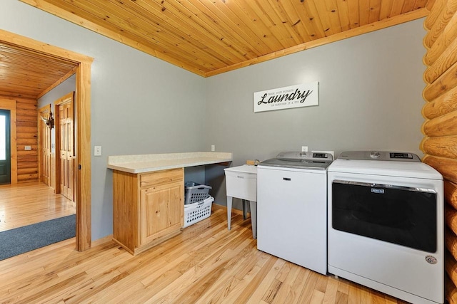 E7498 Mill Rd, Spring Green, WI 53588 - washroom with rustic walls, wooden ceiling, separate washer and dryer, and light wood-style floors