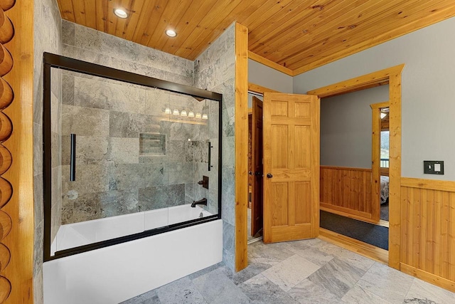 E7498 Mill Rd, Spring Green, WI 53588 - ensuite bathroom featuring bath / shower combo with glass door, wooden ceiling, wainscoting, recessed lighting, and wooden walls