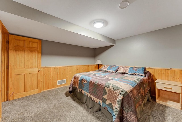 E7498 Mill Rd, Spring Green, WI 53588 - carpeted bedroom with wood walls and wainscoting