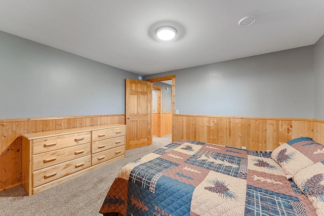 E7498 Mill Rd, Spring Green, WI 53588 - carpeted bedroom featuring wainscoting and wooden walls